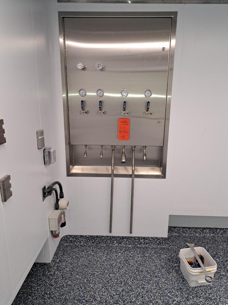 Prefabricated sanitary process skid system assembled by Herman Goldner Co., Inc. with stainless steel piping and instrumentation.