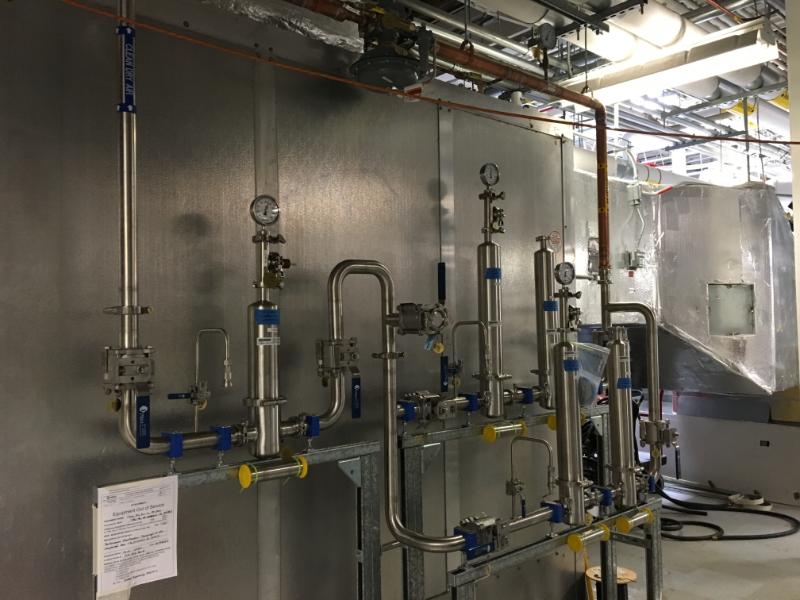 Detailed view of sanitary process piping components and welds fabricated by Herman Goldner Co., Inc.